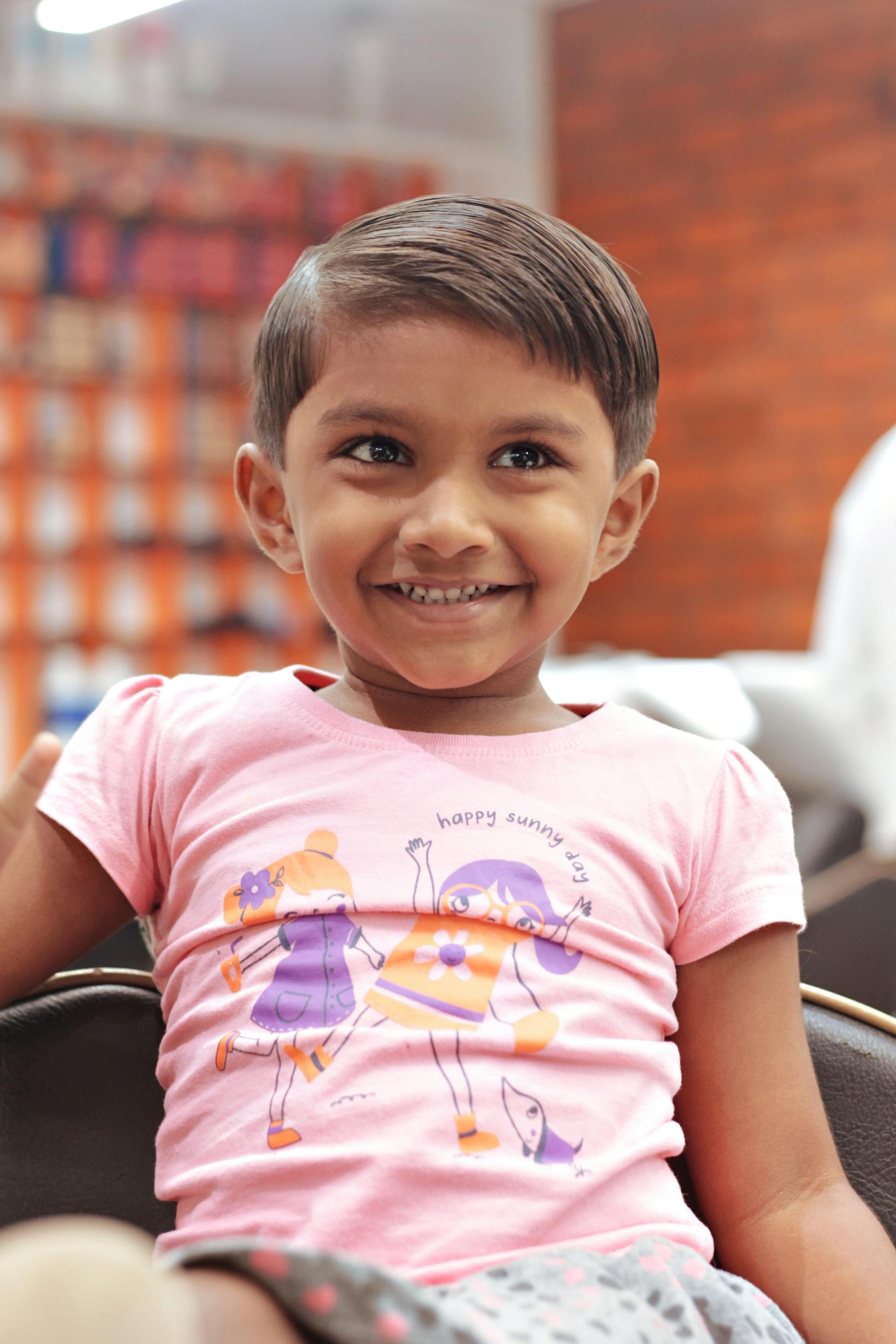 Children's Cut — smiling child at salon
